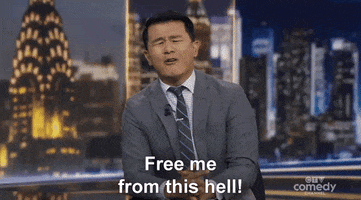TV gif. Ronny Chieng reporting on The Daily Show cries and yells, “Free me from this hell!”