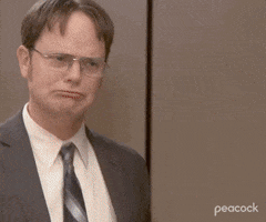 The Office gif. Rainn Wilson as Dwight and Andy Buckley as David embrace in a warm and happy hug. 