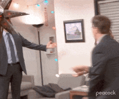 The Office gif. Actor John Krasinski as Jim Halpert on The Office opens his arms wide expecting a hug from Jenna Fischer as Pam. Instead, Rainn Wilson as Dwight Schrute rushes in to embrace his frenemy.