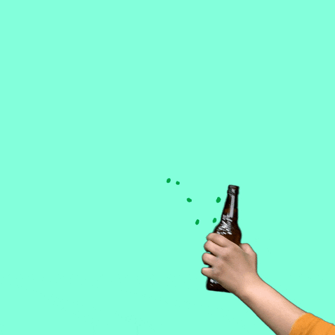 Video gif. Two beer bottles are raised, clinking as a gold and white firework erupts. Kelly green text and a handful of shamrocks appear briefly before disintegrating into the mint green background. Text, "Happy St. Paddy's Day."