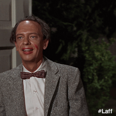 Movie gif. Don Knotts as Roy Fleming in The Reluctant Astronaut enters through a door with a blissful facial expression and lipstick marks on his face.