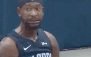 Sports gif. Terrence Ross' eyes dart around as his facial expression seems to say "yikes!"