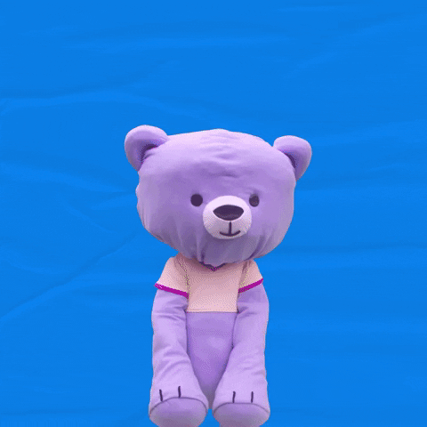 Video gif. Purple bear puppet looks at us and holds its paws up to cover its mouth. Text, “Whyyyyy??”