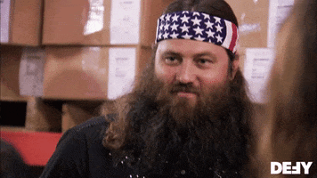 Reality TV gif. Willie Robertson on Duck Dynasty looks around with a satisfied smile and nods his head.