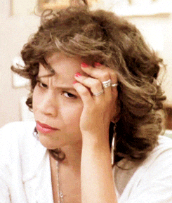 Celebrity gif. Rosie Perez glares in confusion as she rests her head in her perfectly manicured hand, which makes her stink eye extra sassy.