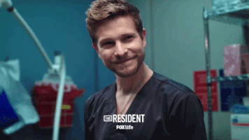 the resident smile GIF