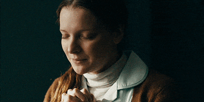 Movie gif. Morfydd Clark as Maud in Saint Maude with her hands folded and eyes closed, praying.