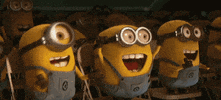 Movie gif. An audience of deliriously ecstatic minions from Despicable Me cheer with their hands in the air.