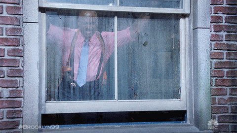 guy tries to block shooter with glass door gif