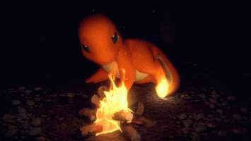 Cartoon gif. Charmander from Pokémon stares at a bonfire happily before yawning and curling up next to it, the flame on their tail burning brightly.