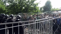 Hungarian Riot Police Face Off With Protesting Refugees at Border