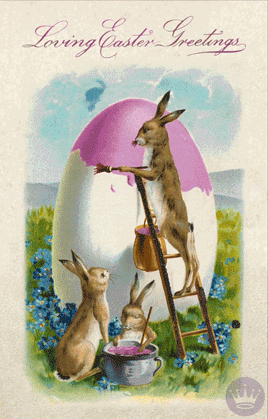 Digital illustration gif. Card shows a moving image of a bunny standing on a ladder painting a giant egg pink as another bunny watches and a baby bunny stirs a pot of pink paint in a field of blue flowers. Text, "Loving Easter Greetings."