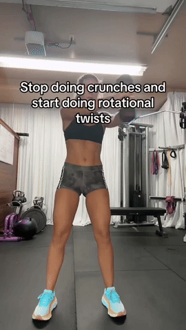 Standing Dumbbell Core Twists GIF