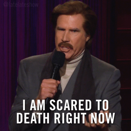 Celebrity gif. Will Ferrell on the Late Late Show, wearing a suit jacket, turtleneck and a scarf, gesticulates firmly with his right hand. Text, "I am scared to death right now"