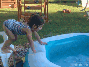 Gif of a little girl balancing her head on side of a paddling pool to forwards roll in but instead rolling all around the edge and falling in