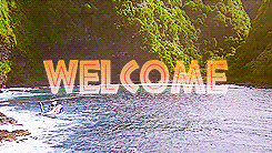 Movie gif. A scene from Jurassic Park. A helicopter flies above a blue ocean and towards a lush, mountain landscape.Text, “Welcome.”