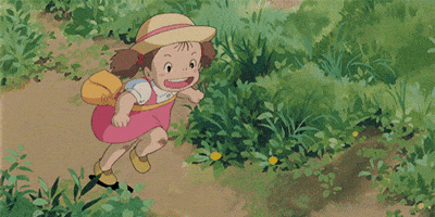 Anime gif. Mei in My Neighbor Totoro runs frantically on a path through the grass.