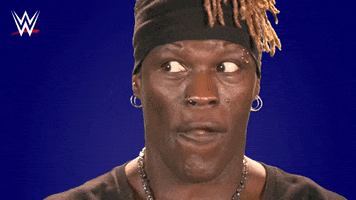 Sports gif. Ron Killings, known as R Truth on WWE, anxiously chews gum and looks side to side exaggeratedly.