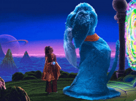 Digital compilation gif. Video clip from Thu Tran's "Good Night," features a giant blue puppet dog nearly double the size of the woman standing next to it. They are both facing each other next to a swirling aura of light. Text, "Good Night."