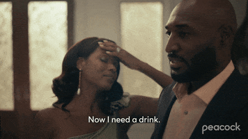 TV gif. Cassandra Freeman as Vivian in Bel-Air rubs her forehead, then nods to Adrian Holmes as Philip when he steps forward and says, "Now I need a drink."