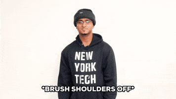Video gif. Teenager brushes both of his shoulders before adjusting his hoodie cockily. Text, "Brushes shoulders off."