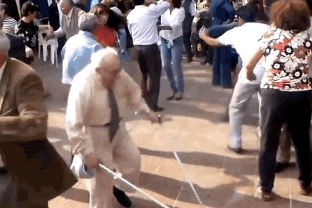 Gif of an old white man with two walking sticks on a dance floor. He throws the sticks to the ground and starts busting moves.