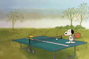 Peanuts gif. Snoopy darts back and forth on a ping pong table as he plays by himself. 