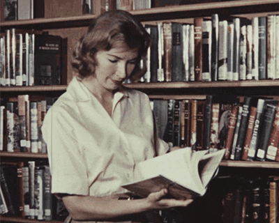 Animated gif of a woman searching in a library.