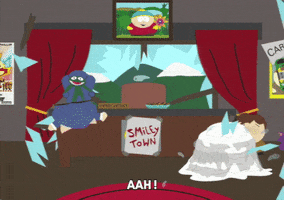 South Park gif. Angry Eric Cartman startles and Francis cowers behind a melting snow pile from the glass raining down from above after a rock flies through the window of the Smiley Town headquarters.