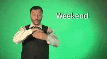 Video gif. A man looks at us and signs the word, “Weekend” in American Sign Language. 