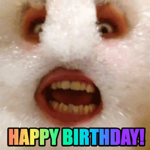 Video gif. A person has put bubbles all over their face and has made eye, nose, and mouth holes. We start zoomed in on their face but pan out and see the whole look. They widen their mouth in excitement and the text reads, "Happy Birthday!" in rainbow.