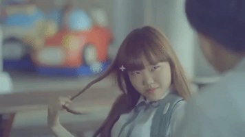 k-pop hair twirl GIF
