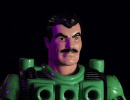 Video gif. A LEGO character that looks like Tom Selleck bobs its head up and down. Maybe Magnum P.I. is listening to a bop?