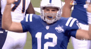Sports gif. Andrew Luck of the Indianapolis Colts slaps his hands on his helmet angrily and squeezes his eyes shut in frustration.