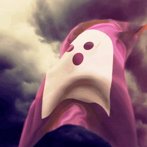 Digital art gif. A purple flag with a cartoon ghost on it flies against a purple sky.