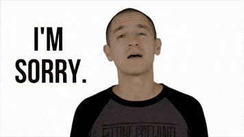 Video gif. A man looks us in the eye with humility and says "I'm sorry."