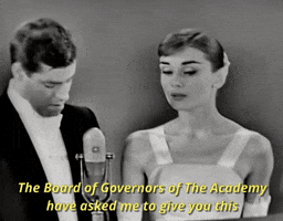 audrey hepburn kiss GIF by The Academy Awards