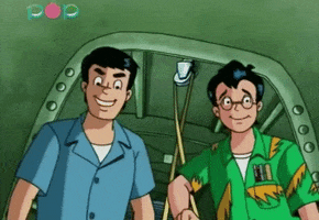 Cartoon gif. From Archie’s Weird Mysteries, Reggie and Dilton give each other a congratulatory high five.