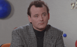 Movie gif. Wearing a patterned blazer, Bill Murray listens to someone offscreen. He turns to us with an unimpressed look that seems to say "can you believe this?"