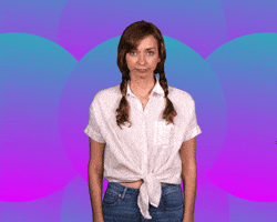Video gif. Lauren Lapkus throws her hands up to her temples and cries, “Whyyyyyyy?”