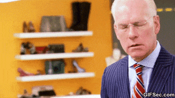 Reality TV gif. Tim Gunn on Project Runway. He's frazzled and he shakes his head and raises his arms at the same time, showcasing his overwhelm.