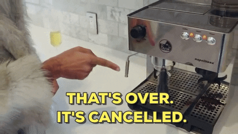 Video gif. Clad in a fur coat, Brenden Miller as Joanne the Scammer presses a button on an espresso machine. Text, “That’s over. It’s canceled.”