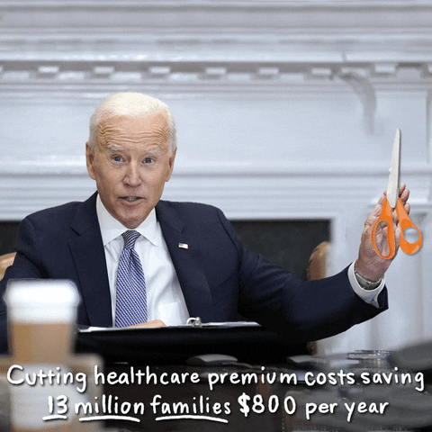 Political gif. Joe Biden with classic orange Fiskars scissors collaged into his hand, cuts the word "costs" each time it floats down into frame. Text, "Cutting healthcare premium costs saving 13 million families $800 a year."
