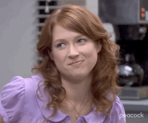 The Office gif. Ellie Kemper as Erin Hannon shakes her head slowly, with a slight smile and a shrug, indicating "maybe."