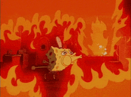 SpongeBob gif. Flames from the grill are filling the kitchen of the Krusty Krab. SpongeBob desperately tries to blow out the fire, but it doesn't have any effect.