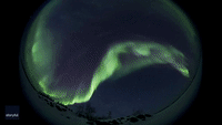 Dazzling Aurora Captured Through Fisheye Lens in Northern Canada