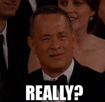 Celebrity gif. Tom Hanks staring at us with squinted eyes, in disbelief at what's being told to him. He says, "Really?" 