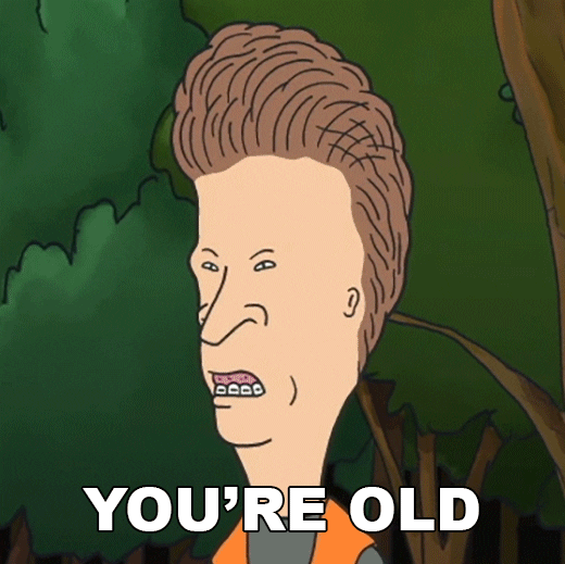 TV gif. Closeup of Butt-head from the animated TV series "Beavis and Butt-head" stands in front of trees, looking off screen and saying, "You're old."