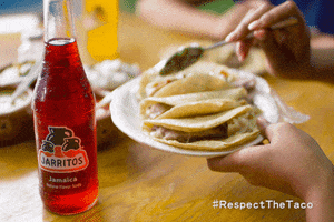 Ad gif. Person adds toppings to their plate of tacos, featuring a red Jarritos soda drink. The bottom right text reads, "#RespectTheTaco."