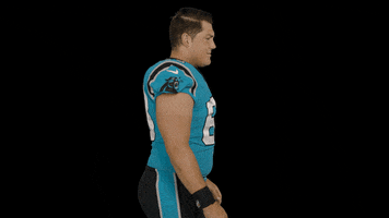 Sports gif. Austin Corbett of the Carolina Panthers raises a quizzical eyebrow as if to say, “Seriously?”
